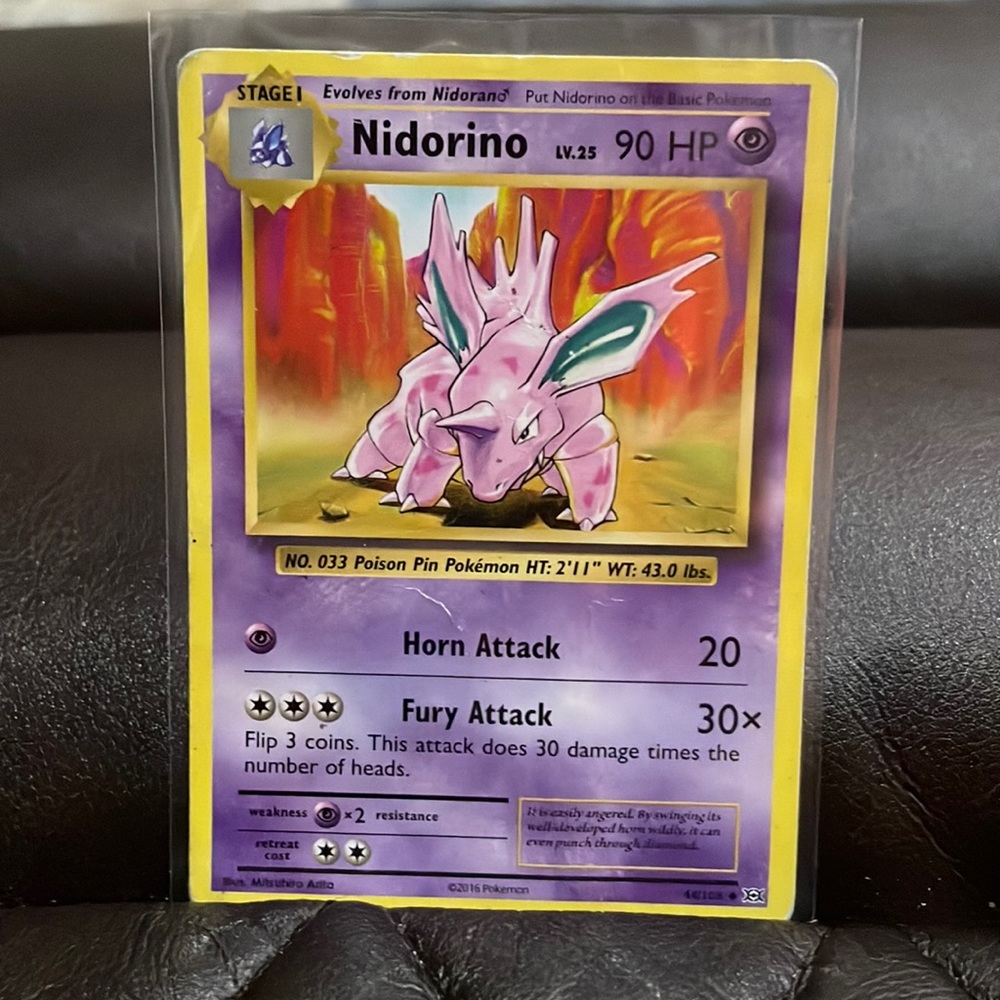 Nidorino Pokémon card 90 HP 2016 - damaged back